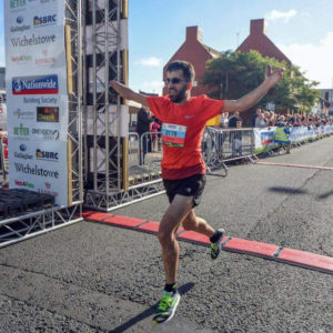 Omer completing the Swindon Half Marathon